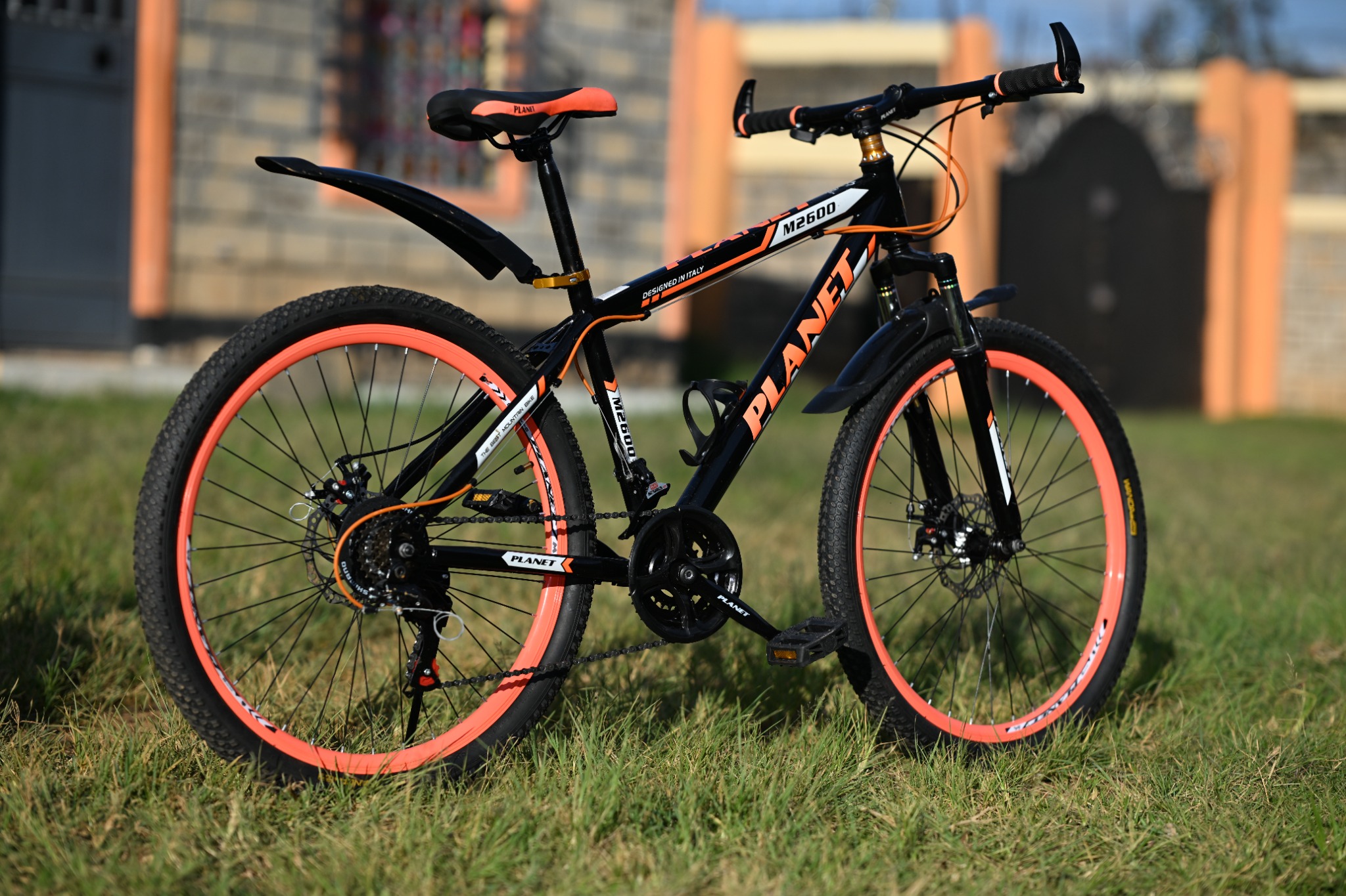 Black and orange Planet mountain bike